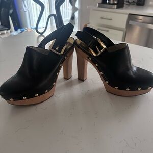 MICHAEL Michael Kors Black Leather Mules with Gold Accents
